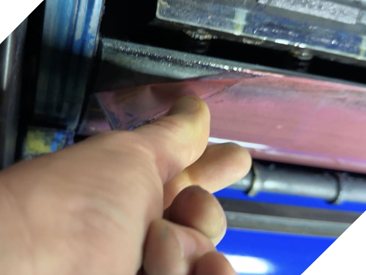 A careless printer incorrectly installed the backing material.